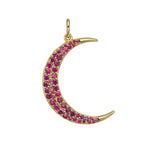 Close-up of gold moon pendant set with vibrant rubies