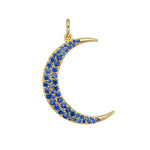 Close-up of gold crescent moon pendant with pavé sapphire stones