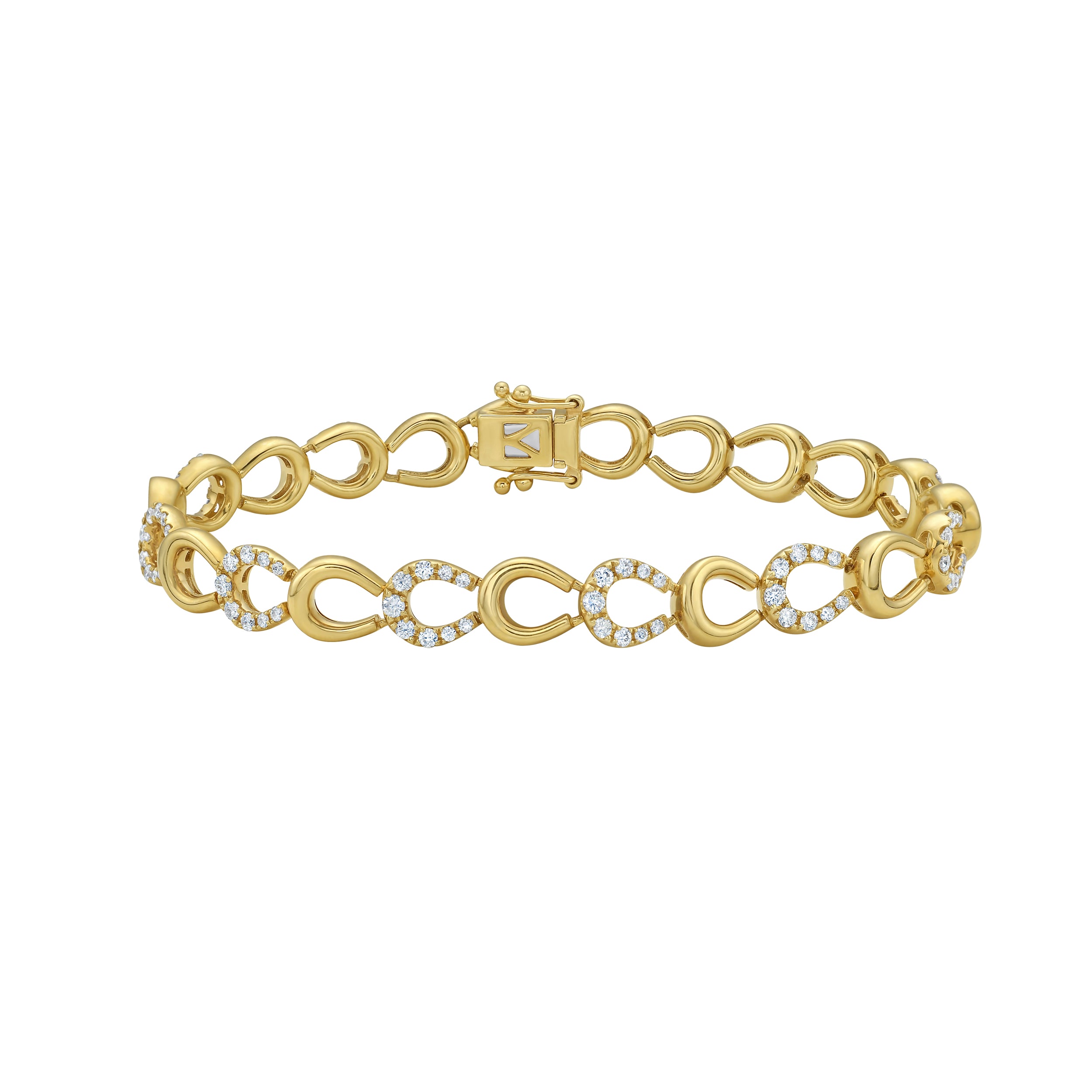 Gold horseshoe and diamond bracelet on a white background