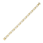 Gold horseshoe and diamond bracelet on a white background
