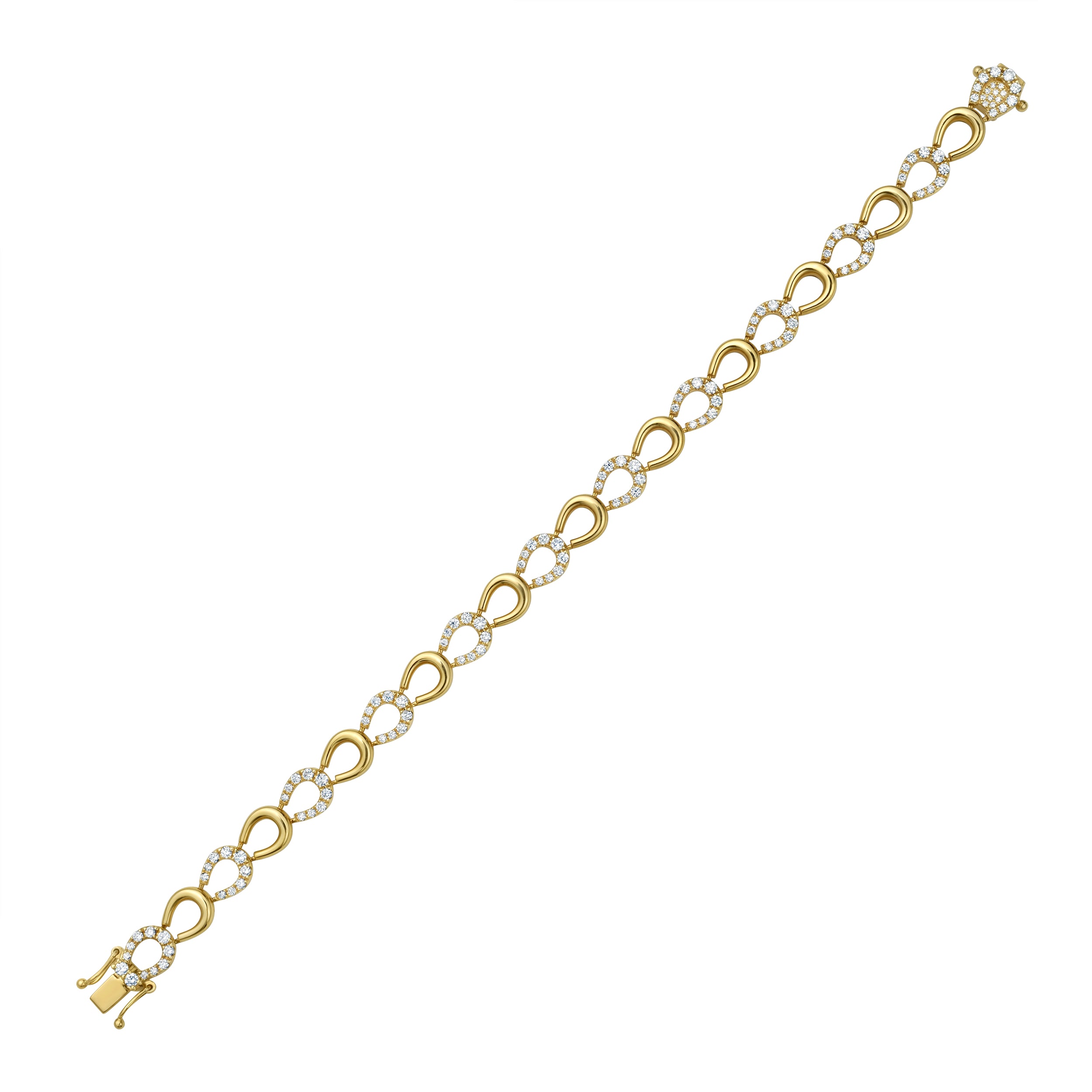 Gold horseshoe and diamond bracelet on a white background