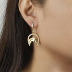 Model wearing Diamond and Gold Horseshoe earrings