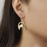 Model wearing Diamond and Gold Horseshoe earrings