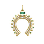 Gold horseshoe-shaped charm with gemstones and diamonds on a white background