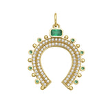 Gold horseshoe-shaped charm with gemstones and diamonds on a white background