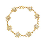 Gold bracelet with star-shaped charms featuring diamonds on a white background