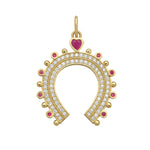 Gold horseshoe-shaped charm with gemstones and diamonds on a white background
