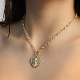 gold and diamond heart charm on a rolo link chain