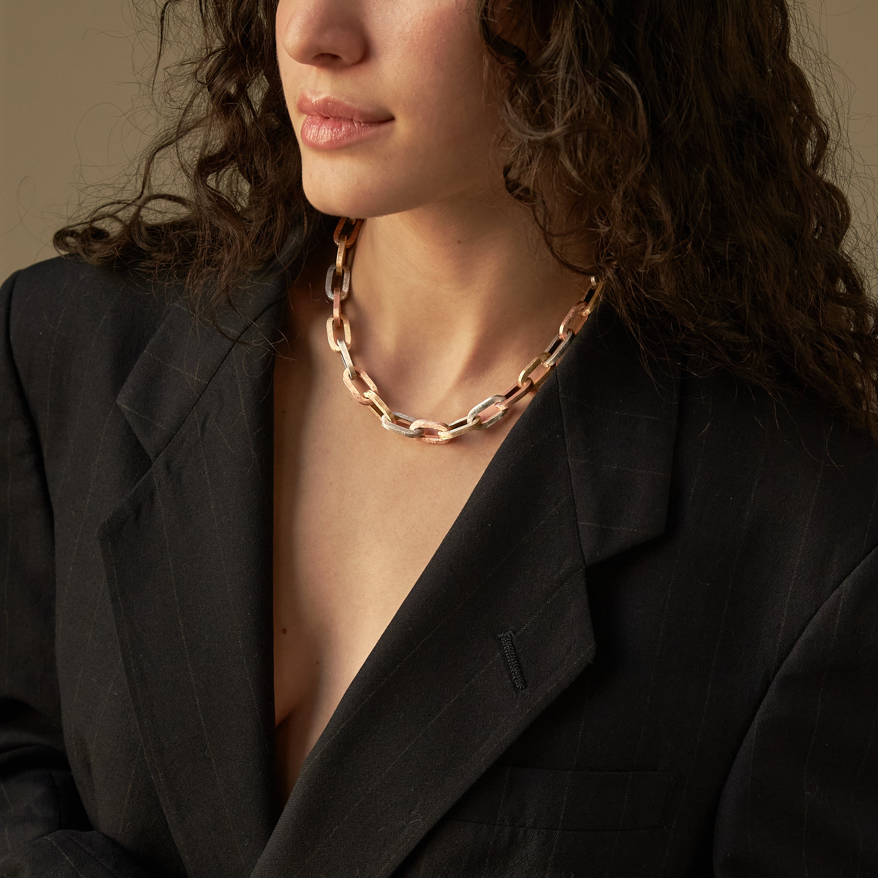 Chunky tri color paperclip chain on model