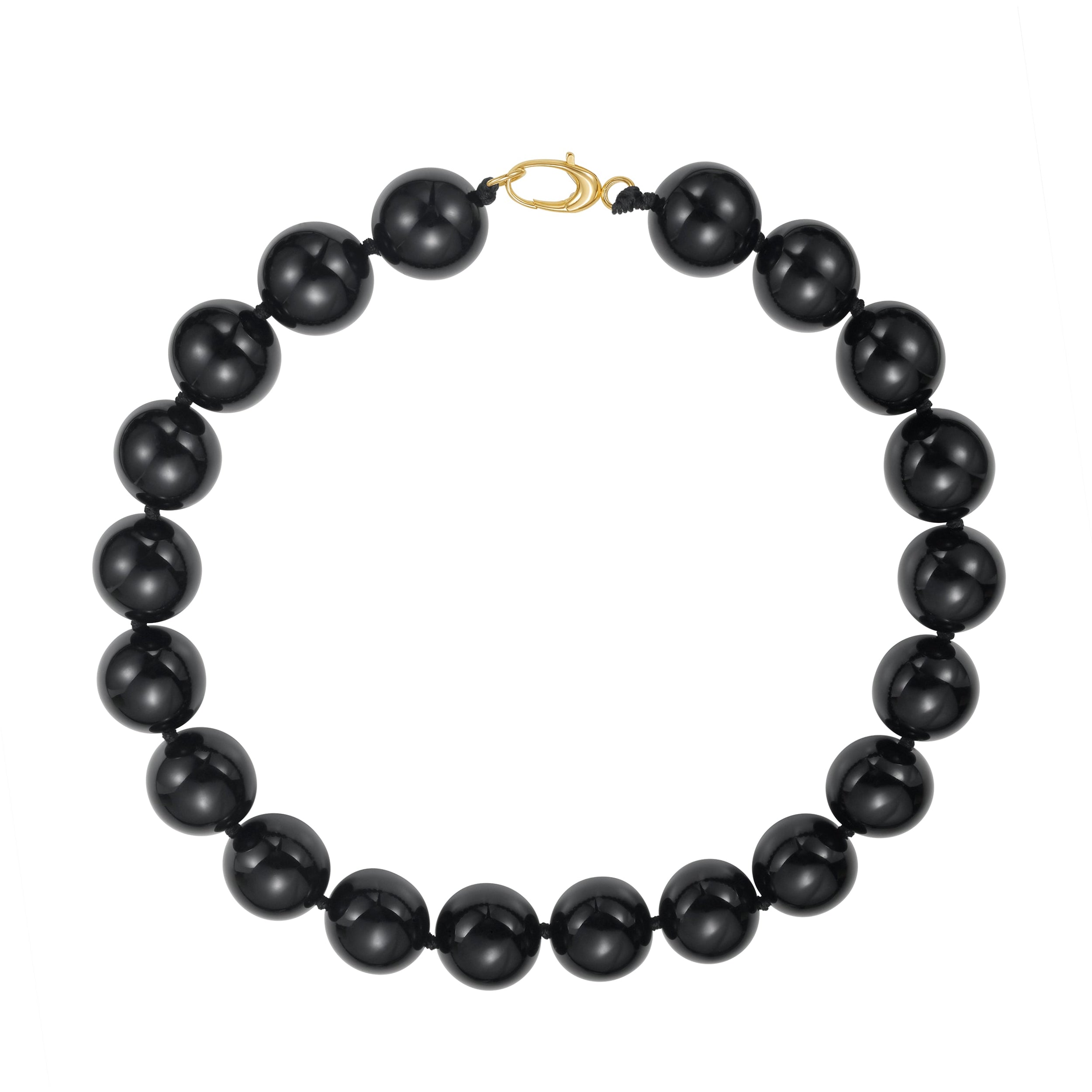 Black beaded necklace with a gold clasp on a white background
