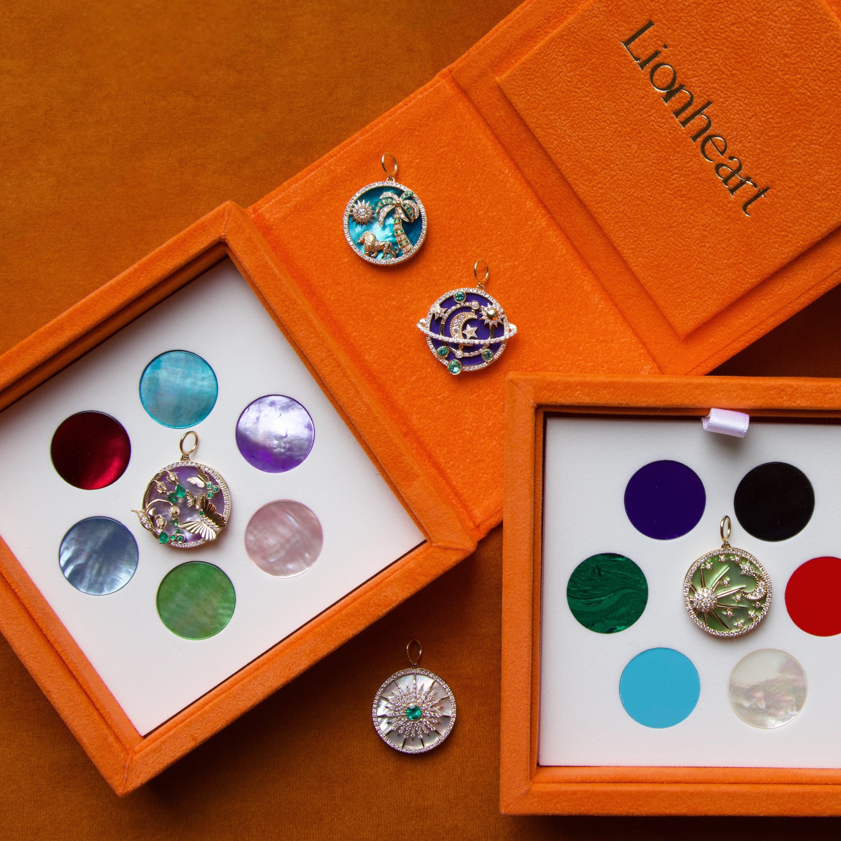 Colorful pendants in an open orange box with 'Lionheart' branding.