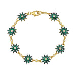 Lumiere gold star charm bracelet featuring diamonds and emeralds by Lionheart Jewelry